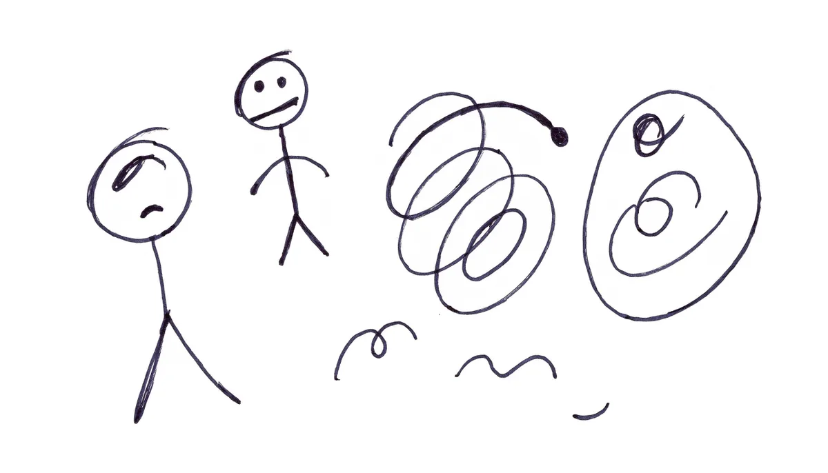 Stick figures and scribbles in pen